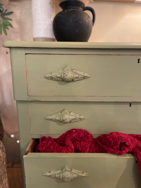 4 Drawer Dresser with Carved Wood Poles in Sun-Dried Olive